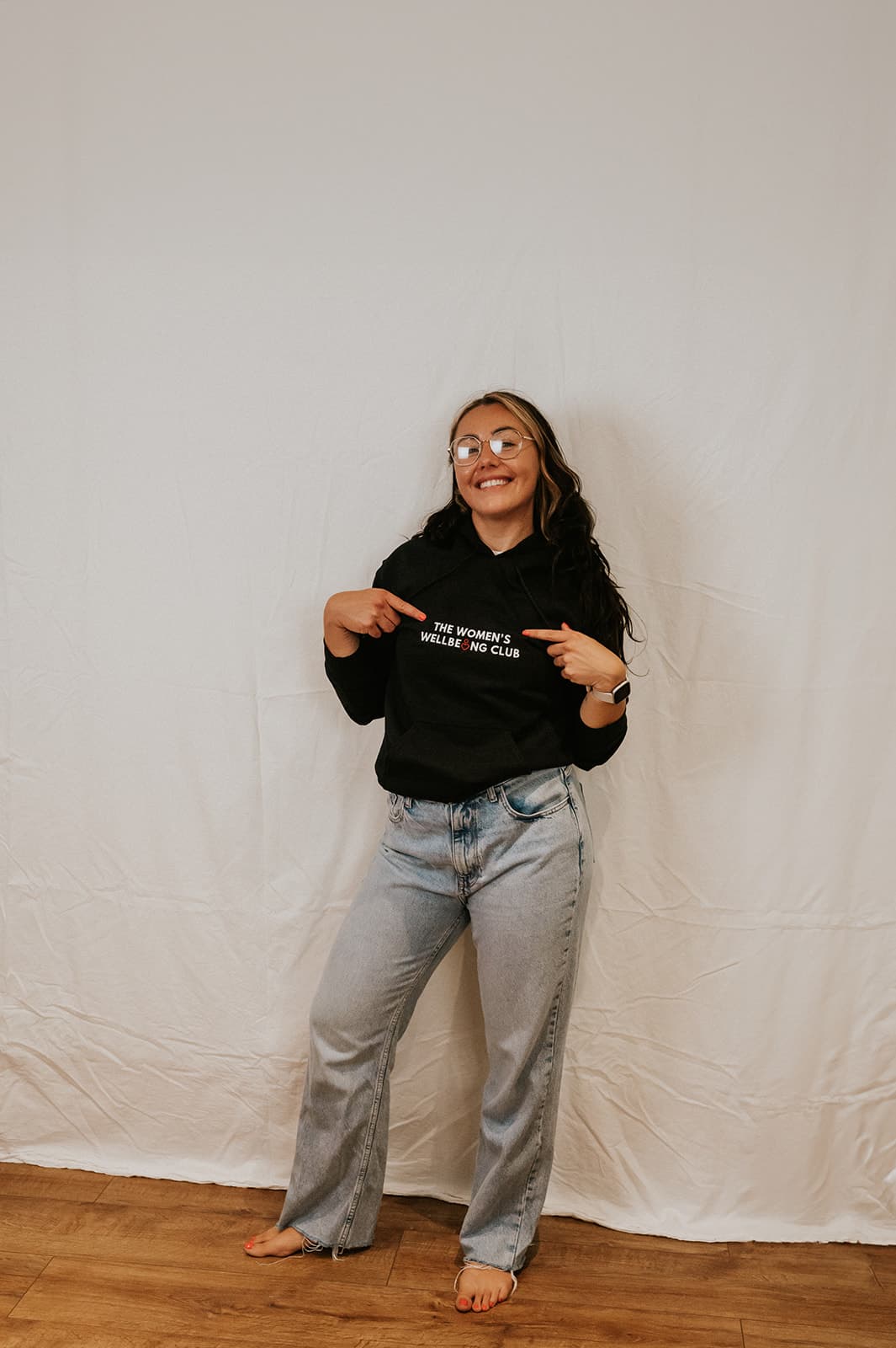 Nicole, wearing a black ‘The Women’s Wellbeing Club’.